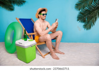 Full length photo of positive funky shirtless man straw hat chatting instagram twitter telegram facebook isolated blue color background - Powered by Shutterstock