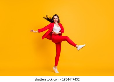 Full Length Photo Of Pretty Classy Girl Dance Open Mouth Wear Red Suit Jacket Trousers Sneakers Eyewear Isolated Yellow Color Background