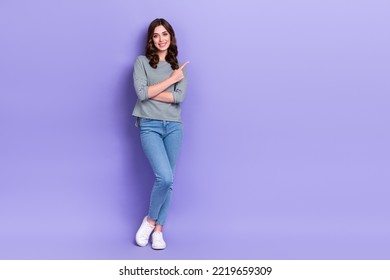 Full length photo of pretty lady wear stylish clothes arm direct empty space visit cafe nice service isolated on purple color background - Powered by Shutterstock