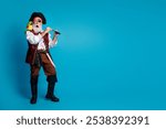 Full length photo of senior funny pirate grandpa amazed binoculars tube wear masquerade party costume isolated blue color background