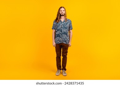 Full length photo of serious confident guy wear print shirt walking empty space isolated yellow color background - Powered by Shutterstock