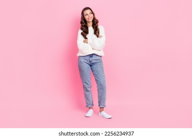Full length photo of shiny dreamy lady wear white sweater arms folded looking empty space isolated pink color background - Shutterstock ID 2256234937