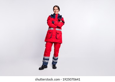 Full length photo of shiny positive young woman paramedic wear red jacket smiling arms crossed isolated white color background