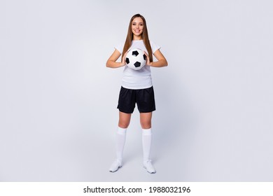 Full Length Photo Of Sports Captain Lady Player Soccer Women Team Hold Hands Leather Ball Wear Football Uniform T-shirt Shorts Boots Knee Socks Isolated White Color Background