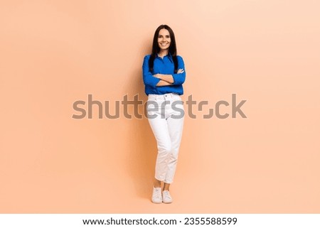 Full length photo of stunning lady office manager hands folded wear trendy blue smart casual outfit isolated on beige color background