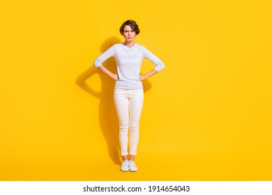 Full Length Photo Of Sweet Angry Young Lady Dressed White Shirt Standing Arms Waist Isolated Yellow Color Background