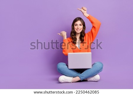 Full length photo of sweet charming woman dressed cardigan working gadget thumbs empty space isolated purple color background