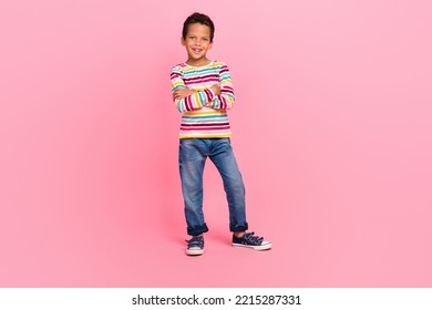 Full length photo of sweet cheerful good mood boy dressed striped shirt jeans outfit arms crossed isolated on pink color background - Powered by Shutterstock