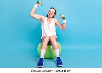 Full length photo of tired millennial brunet guy do aerobics wear singlet shorts sneakers socks isolated on blue background