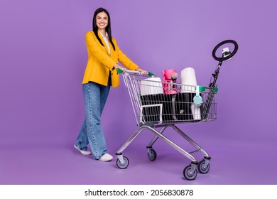 Full Length Photo Of Trendy Businesswoman Model Wear Yellow Jacket Blazer Jeans Sell Old Things Online Isolated On Violet Color Background