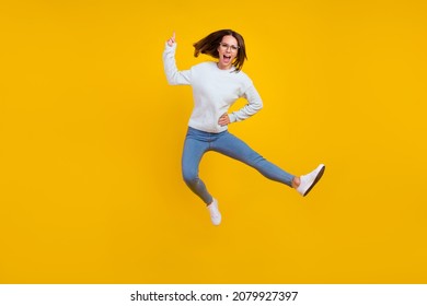 Full length photo of unhappy angry woman jump wear glasses finger warn isolated on yellow color background - Shutterstock ID 2079927397