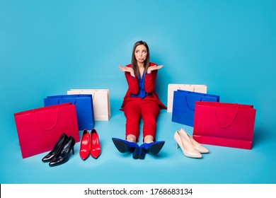 Full length photo of upset lady successful worker sit offended floor near shoes shopping bags difficult select wear red suit blouse blazer pants high-heels isolated blue color background - Shutterstock ID 1768683134