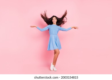 Full Length Photo Of Young Asian Girl Happy Positive Smile Show Hands Volume Hair Shampoo Isolated Over Pink Color Background