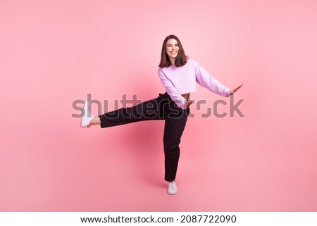 Full length photo of young cheerful woman have fun festive playful isolated over pink color background