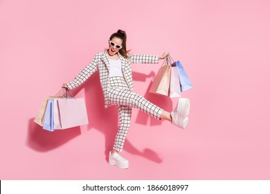 Full Length Photo Of Young Excited Crazy Girl Go Shopping Black Friday Discount Wear Jacket Pants Hold Bags Isolated Over Pastel Color Background