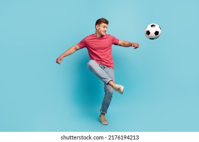 Full length photo of young man play soccer kick ball hobby sportive isolated over blue color background - Shutterstock ID 2176194213