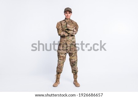 Full length photo of young woman confident crossed hands soldier officer army camouflage uniform isolated over white color background