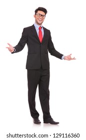 Full Length Picture Of A Young Business Man Welcoming Everybody With His Arms Wide Opened And With A Large Smile On His Face, On White Background