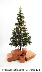 full length plastic christmas tree simply decorated with gold ornaments and tinsel gold star - White Fake Christmas Tree full length plastic christmas tree simply decorated with gold ornaments and tinsel gold star - White Fake Christmas Tree