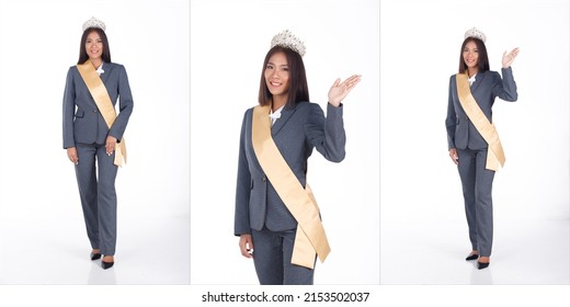 Full length Portrait of 20s Asian business Woman as Miss Beauty Pageant Contest in black short hair white shirt gray suit pant shoes. Female wear sash diamond winner crown, white Background isolated - Shutterstock ID 2153502037