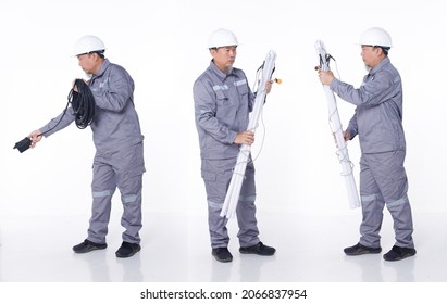 Full Length Portrait 50s 60s Asian Elderly Man In Gray Uniform Hardhat As Electric Engineer, Isolated. Electrical Technician Male Carry Many Bulk Tube Neon Led Lights, White Background Studio