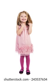 Full Length Portrait Of An Adorable Little Girl With Pink Dress Standing Over White Background