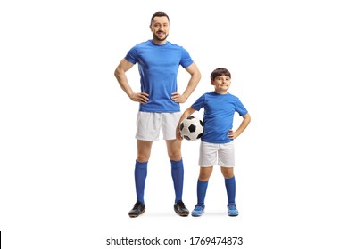 Full Length Portrait Of An Adult Soccer Player And A Kid Holding A Ball Isolated On White Background