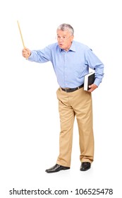 Full length portrait of an angry mature teacher holding a wand and gesturing isolated on white background