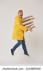 Full Length Portrait Of Animated Delivery Guy Jumping High Holding Pizza Boxes Against White Background, Super Fast Food Service