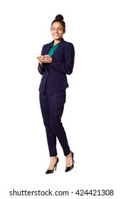 Full Length Portrait Of Attractive Young Business Woman With A Cell Phone Standing Over White Background