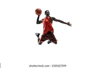 Full Length Portrait Of A Basketball Player With A Ball Isolated On White Studio Background. Advertising Concept. Fit African American Athlete Jumping With Ball. Motion, Activity, Movement Concepts.