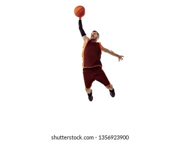 Full length portrait of a basketball player with ball isolated on white background. Advertising concept. Fit caucasian athlete jumping at studio. Motion, activity, movement concepts. - Shutterstock ID 1356923900