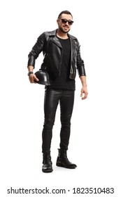 Full length portrait of a biker in leather jacket and pants holding a leather helmet isolated on white background - Shutterstock ID 1823510483