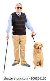 Full length portrait of a blind person holding a walking stick and a dog isolated on white background