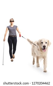 Full Length Portrait Of A Blind Woman Walking With The Help Of A Dog Isolated On White Background
