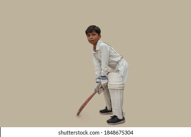 Full length Portrait of boy Playing cricket