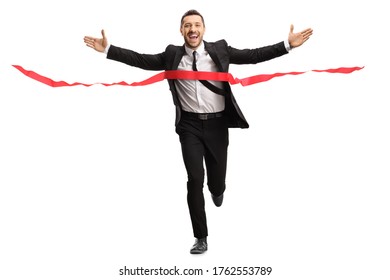 Full Length Portrait Of A Businessman Running A Marathon Race In A Suit And Crossing The Finish Line Isolated On White Background