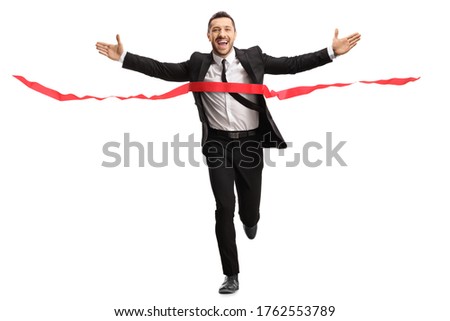 Full length portrait of a businessman running a marathon race in a suit and crossing the finish line isolated on white background