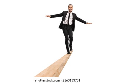 Full length portrait of a businessman walking on a wooden beam isolated on white background - Powered by Shutterstock