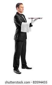 Full Length Portrait Of A Butler With Bow Tie Carrying An Empty Tray Isolated Against White Background