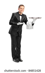 Full Length Portrait Of A Butler Holding An Empty Tray Isolated Against White Background