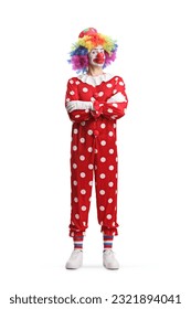 Full length portrait of a clown standing with folded arms isolated on white background
