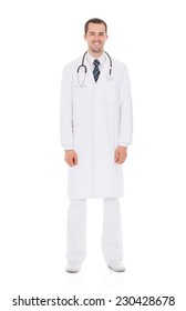 Full Length Portrait Of Confident Male Doctor Standing Over White Background