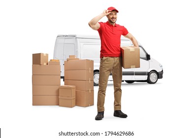 Full Length Portrait Of A Delivery Man With A Van Holding A Cardboard Box And Greeting Isolated On White Background