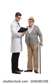 Full Length Portrait Of A Doctor And An Elderly Patient Looking At A Clipboard Isolated On White Background