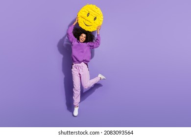 Full length portrait of excited energetic afro hairstyle girl hold large cool like emodji isolated on violet color background