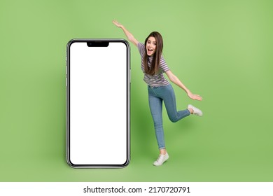 Full length portrait of excited positive person arms wings playing empty space blank isolated on green color background - Shutterstock ID 2170720791