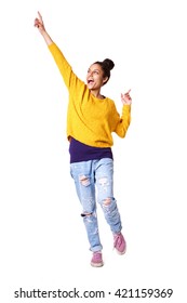 Full Length Portrait Of Excited Young Woman Standing With Her Arms Up On White Background