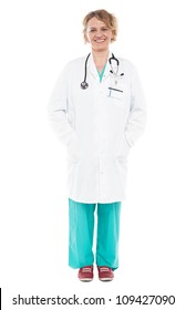 Full Length Portrait Of Experienced Female Doctor Isolated Against White Background