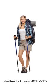 Full Length Portrait Of A Female Hiker Posing With Hiking Equipment Isolated On White Background